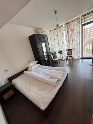a bedroom with a large bed in a room at Ritz in Sofia