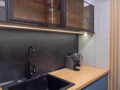a kitchen with a black sink and a counter at Blue Iris, 2BR, Stunning Views, Jacuzzi and Workspace in Sofia