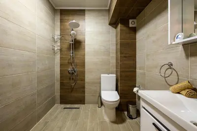 a bathroom with a toilet and a shower at DreamAparts in Velingrad
