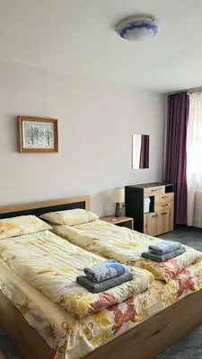 a bedroom with two beds with towels on them at Charming Urban Retreat in Sofia in Sofia