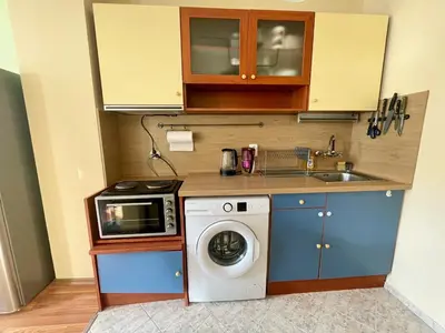 a kitchen with a washing machine and a sink at Charming Urban Retreat in Sofia in Sofia