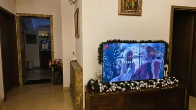a flat screen tv sitting on a stand in a living room at Vintage H&R St Anna in Sofia