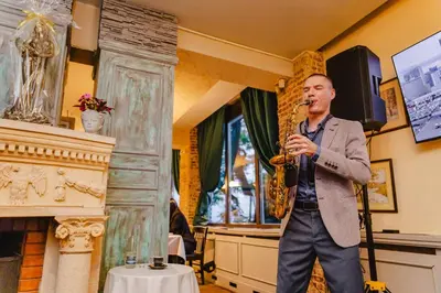 a man playing a saxophone in a room at Vintage H&R St Anna in Sofia