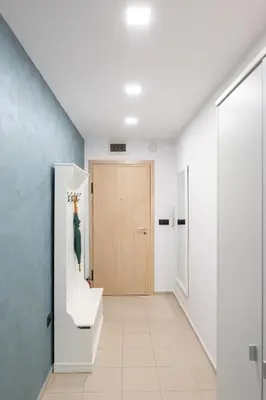 a hallway with a door and a stairwell at Studio Sapphire in Sofia