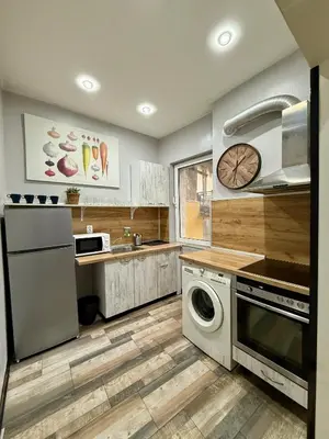 a kitchen with a washer and dryer in it at The Rainbow 10 in Sofia