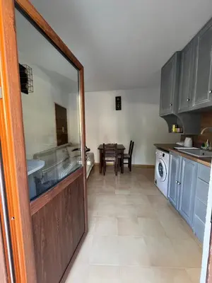 a kitchen with a door leading to a dining room at Apаrtment Melnik home in Melnik