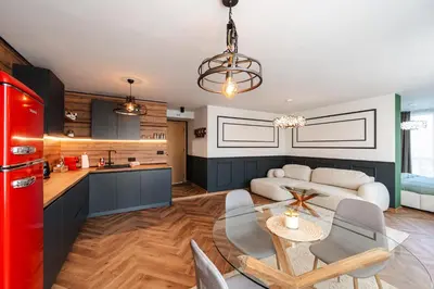 a kitchen and living room with a red refrigerator at Уютно Студио Verde Suites 33 in Blagoevgrad