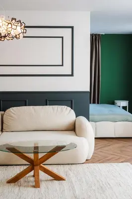 a living room with a couch and a table at Уютно Студио Verde Suites 33 in Blagoevgrad