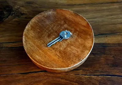 a key sitting on top of a wooden table at Smart Studio in the heart of Sofia in Sofia