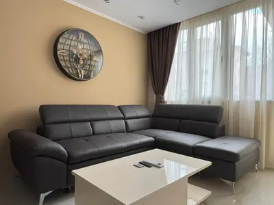 a living room with a couch and a table at ApartmentSpiceDevin in Devin
