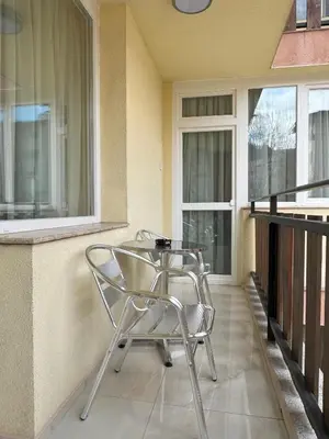 a chair sitting on the porch of a house at ApartmentSpiceDevin in Devin