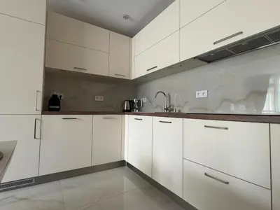 a white kitchen with white cabinets and a sink at ApartmentSpiceDevin in Devin