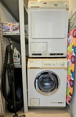 a washer and dryer sitting in a room at Central Springs Apartment in Sofia