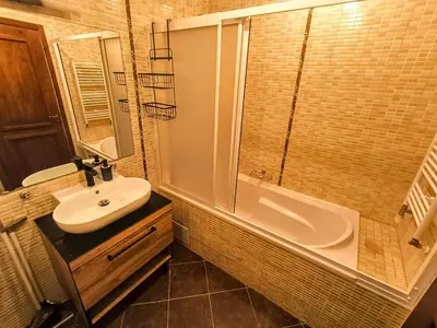 a bathroom with a sink and a shower and a tub at Studio DeLuxe King with mountain view and spa rilski in Bansko