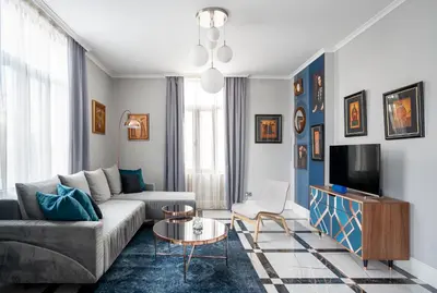 a living room with a couch and a tv at Landmark Luxe 2BR Apt with Parking in Sofia