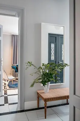 a hallway with a bench and a mirror at Landmark Luxe 2BR Apt with Parking in Sofia
