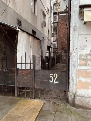 a building with a gate with the number on it at Landmark Luxe 2BR Apt with Parking in Sofia
