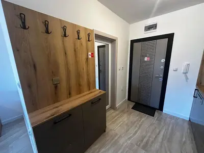 a room with a large wooden closet with a wooden counter at Apartment Aria 4 in Velingrad