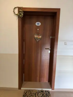 a wooden door with a heart on it at Apart Center Nikola in Plovdiv