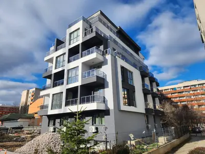 a white building with balconies on the side of it at Continental studios 3 in Sofia