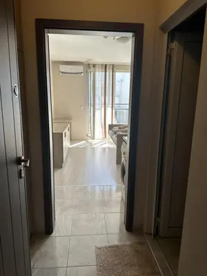 a hallway with a door open to a bathroom at Good Morning in Sofia