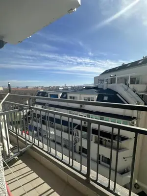 a balcony with a view of two trains at Good Morning in Sofia