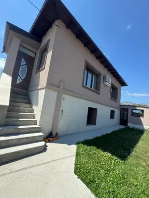 a white house with stairs and a grass yard at Kamberovi house Kalofer Къща Камберови Калофер in Kalofer