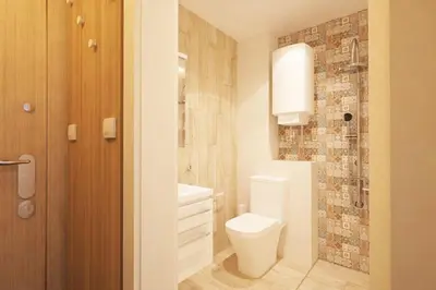 a white bathroom with a toilet and a shower at Natan Royal in Sofia