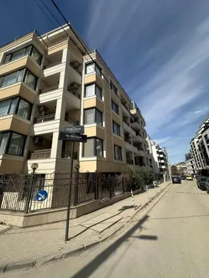 a tall building on the side of a street at The Last Dollar in Sofia