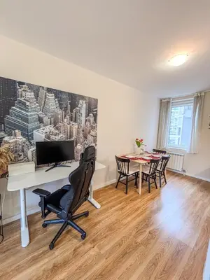 an office with a desk with a computer and chairs at Scandi Suite Business & Leisure in Sofia