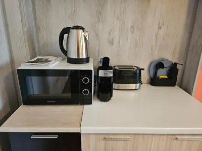 a microwave sitting on top of a counter at Hot Spot 2bdrm apartment 1 in Sofia