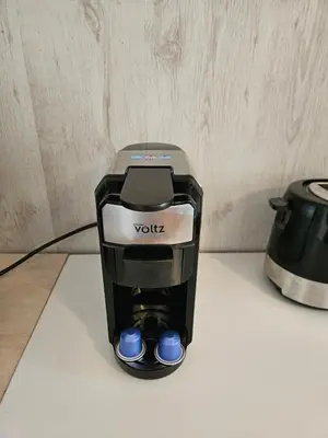 a black coffee maker sitting on a counter at Hot Spot 2bdrm apartment 1 in Sofia