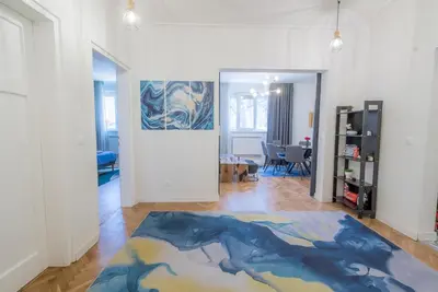 a living room with a large painting on the wall at 35 Seconds Away From the Main Street, Free Secured Parking in Sofia