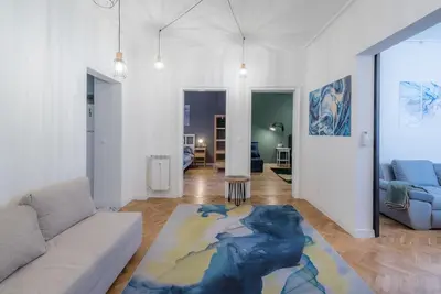 a living room with a couch and a map rug at 35 Seconds Away From the Main Street, Free Secured Parking in Sofia