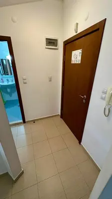 a hallway with a door and a tile floor at Belvedere Holiday Club Apartment 503 in Bansko
