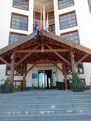 a building with awning and stairs in front of it at Belvedere Holiday Club Apartment 503 in Bansko