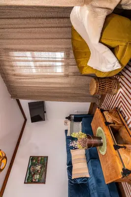 a view of a room with a bed and a window at АРТ Къща Широка Лъка in Shiroka Lŭka