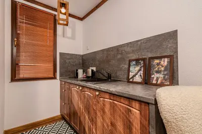 a kitchen with a sink and a counter top at АРТ Къща Широка Лъка in Shiroka Lŭka