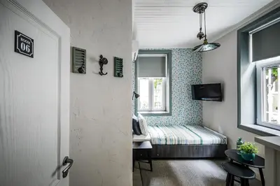 a hallway with a room with a bed and a door at 5 Vintage Guest House in Sofia