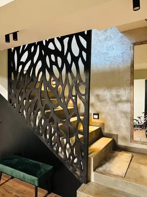 a staircase with a iron gate with a green bench at Luxury Park Villa in Sandanski