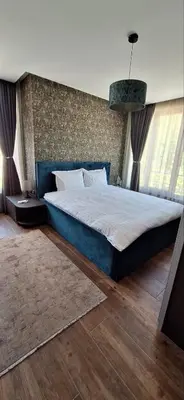 a bedroom with a large bed in a room at Luxury Park Villa in Sandanski