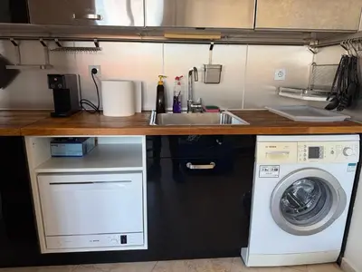 a kitchen with a sink and a washing machine at Apartment near Vitosha mountain, self check-in, with underground parking in Sofia