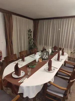 a conference room with a long table with hats on it at Ловна резиденция ДЛС Извора in Devin