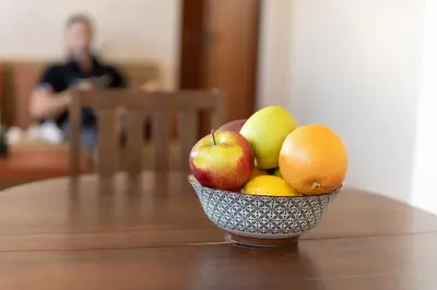 a bowl of fruit sitting on top of a table at Studio KFC in Sofia