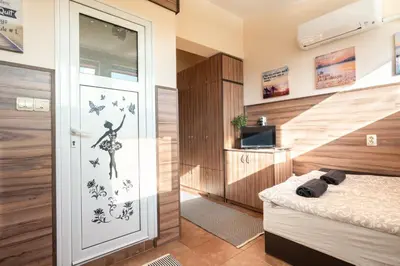 a bedroom with a door with a woman stenciled on it at Studio Subway in Sofia