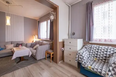 a small room with a bed and a couch at Little HoMe with a Park View by Flat Mаnager in Sofia