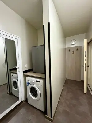 a laundry room with a washer and dryer at Maxi studio & private parking included in Sofia