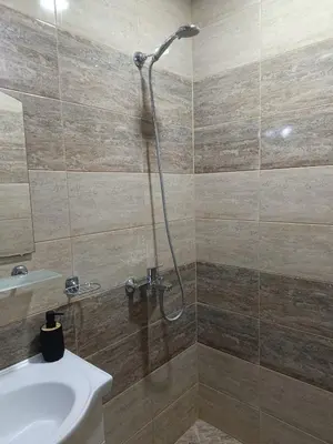 a bathroom with a shower with a sink and a toilet at One-Bedroom Apartment-14 Filip Makedonski 49B in Plovdiv