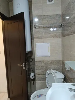 a bathroom with a toilet and a sink at One-Bedroom Apartment-14 Filip Makedonski 49B in Plovdiv