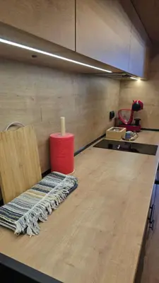 a kitchen with a counter with a red container on it at Studio79 in Plovdiv